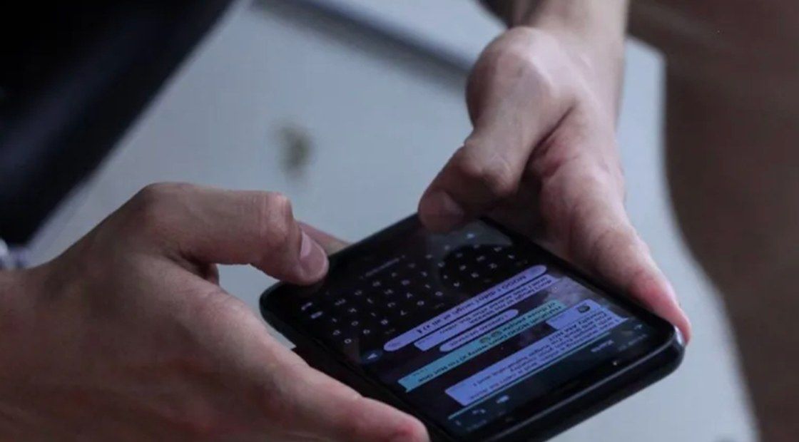 Customer using WhatsApp on a smartphone